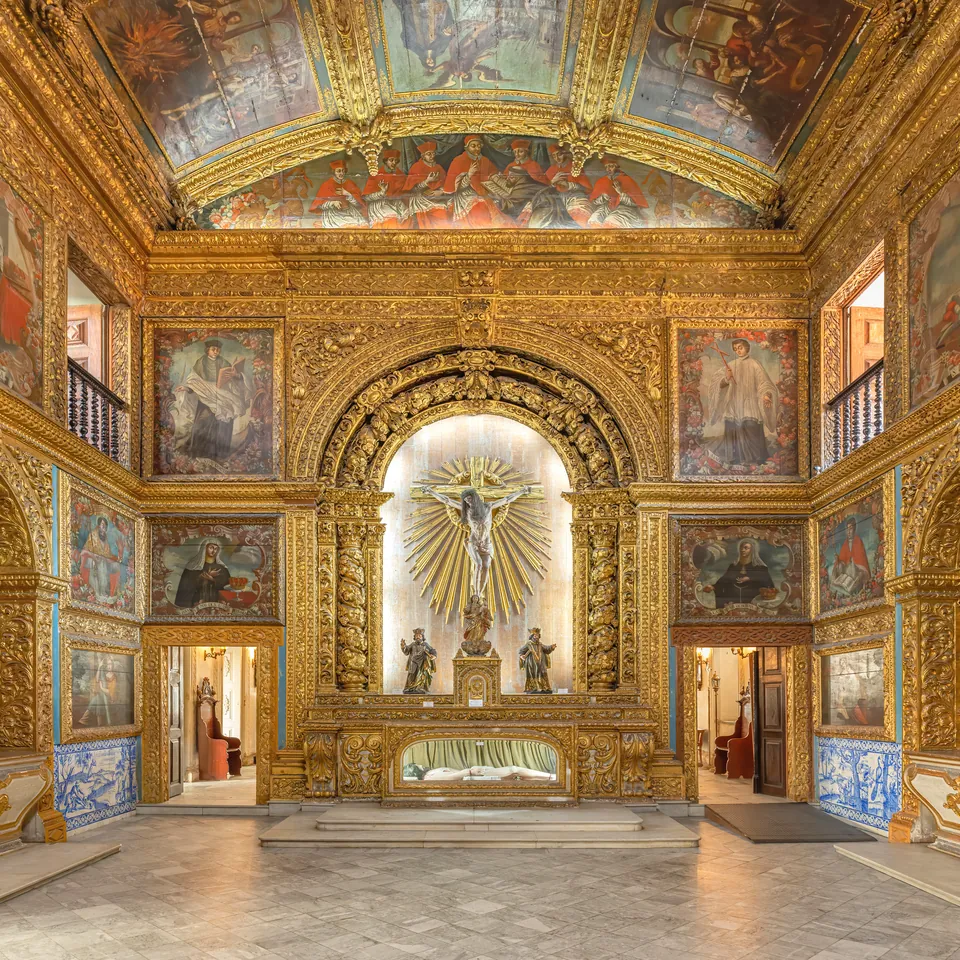 The gilded baroque interior of the Golden Chapel in Recife, every wall and arch covered in carved gold and painted panels